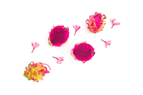 Fruit composition with dragon fruits and tropical flowers on white background. Flat lay, top view. - Photo, Image