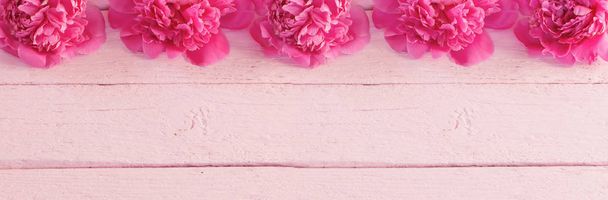 pink peonies on wooden background - Fotó, kép