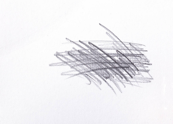 multiple linear pencil scratches on blank paper surface. - Photo, Image