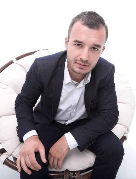 young businessman sitting in a comfortable chair - Fotó, kép