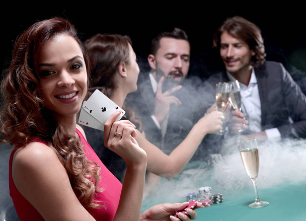 adult group celebrating friend winning blackjack - Zdjęcie, obraz