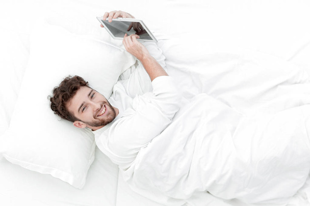 background image .smiling man digital tablet. - Fotografie, Obrázek