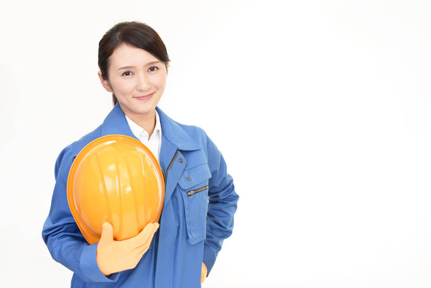 uśmiechający się pracownik kobiece kobieta na białym tle - Zdjęcie, obraz