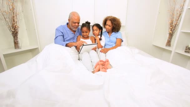 Ethnic Sisters and Grandparents Wireless Tablet Bed - Footage, Video