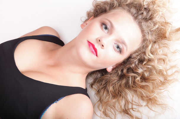 beautiful long blond curly hair of young attractive woman - Zdjęcie, obraz