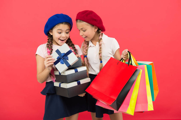 small girl children with shopping bags. friendship and sisterhood. Birthday and christmas presents. International childrens day. big sale in shopping mall. Happy shopping online. Successful shopping - Φωτογραφία, εικόνα