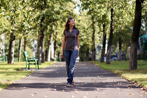 Full length, walking woman in autumn park - Photo, Image