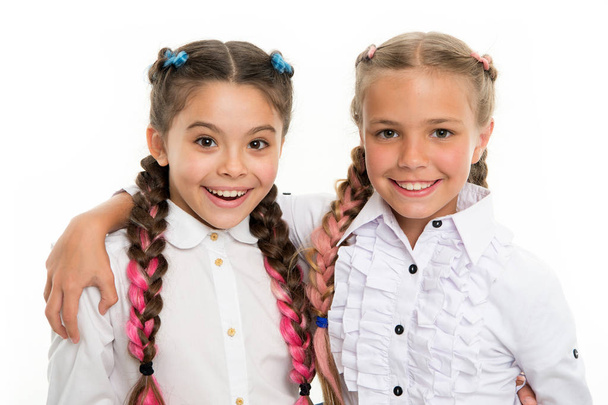 small kid fashion. Childhood happiness. Friendship and sisterhood. small girl children with perfect hair. childrens day. Back to school. Happy little sisters. Beauty and fashion. Amazing story - Foto, Imagen