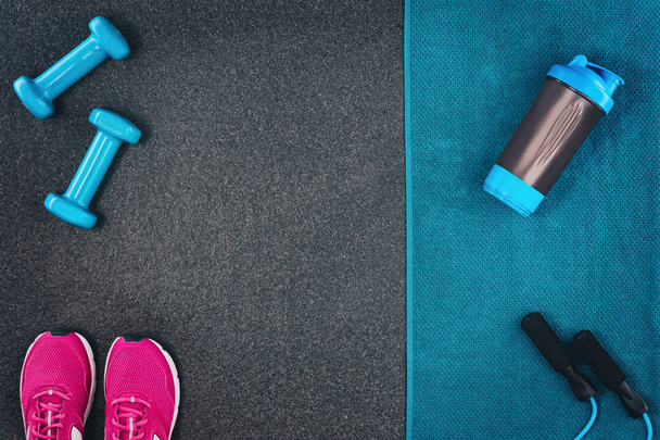 Fitness or bodybuilding background. Dumbbells on gym floor, top view - Φωτογραφία, εικόνα