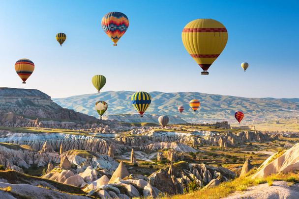 Hot air balloons flying over Cappadocia, Turkey - 写真・画像