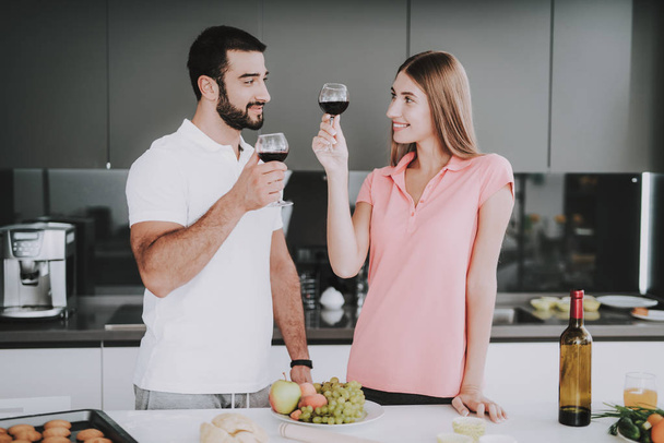 Happy Family On Kitchen. Drinking Wine Concept. Romantic Date On A Kitchen. Cheerful Sweethearts. Happy Together. Beautiful Moment. Great Holiday. - Fotoğraf, Görsel