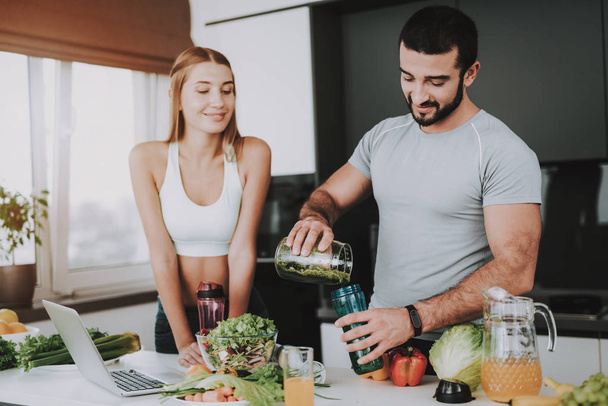 A Couple Is Preparing A Salad For A Breakfast. Vegetables Cocktail. Healthy Lifestyle Concept. Cooking Together. Sporty Athele. Young And Beautiful. Fresh Nutrition. Holiday Leisure. - Fotoğraf, Görsel