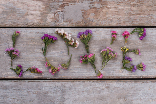 Love word made of statice limonium flowers. - Photo, Image