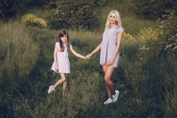 mom and daughter outside - 写真・画像