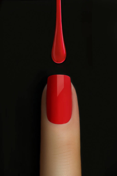 Drop of red nail polish dripping on nail isolated on black. Finger point isolated white background. - Fotó, kép