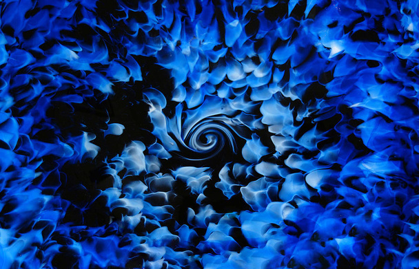 close up abstract blue and black glass design with swirl center - Φωτογραφία, εικόνα