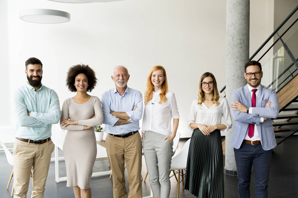 Line of happy and positive business people standing in the office - Photo, Image