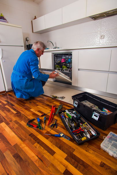 Plumber fixing the household appliances - Photo, Image