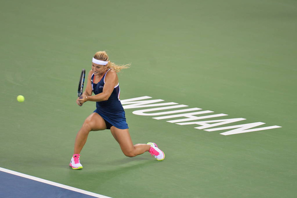 Dominika Cibulkova of Slovakia returns a shot to Petra Kvitova of Czech Republic in their women's singles fnal match during the WTA Wuhan Open 2016 tennis tournament in Wuhan city, central China's Hubei province, 1 October 2016 - Фото, зображення