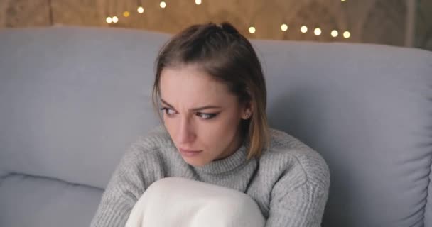 Sad sepressed young woman crying at home - Materiał filmowy, wideo