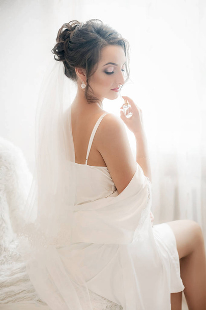 Beautiful young bride before wedding at home - Photo, Image