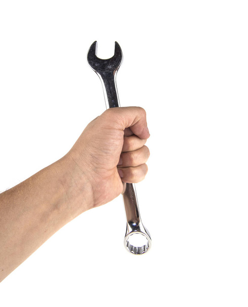 holding tool wrench in hand on white background - 写真・画像