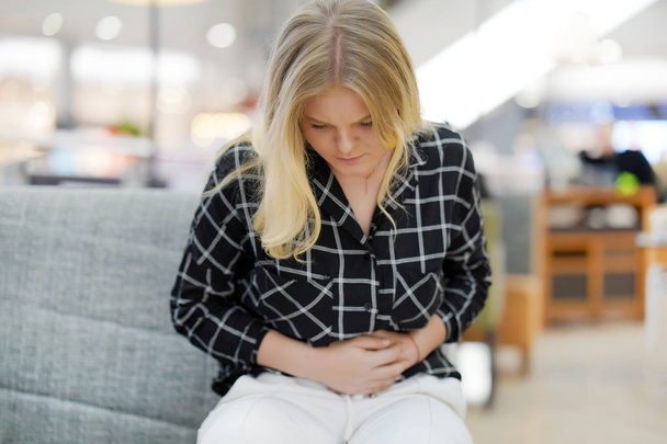 Portrait of a young woman having painful stomachache. Chronic gastritis. Body And Health Care Concept. - Fotoğraf, Görsel