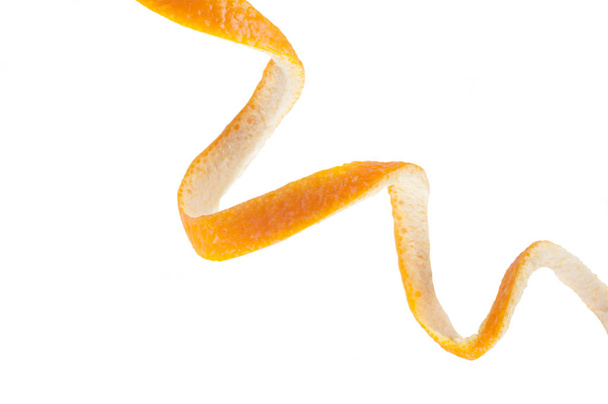 orange peel in the form of a spiral, isolated on white background - Zdjęcie, obraz