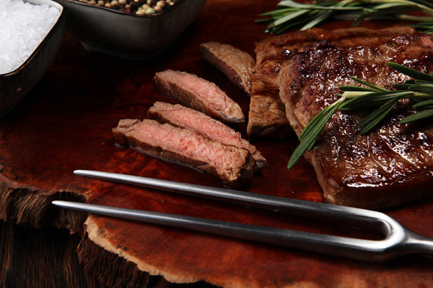 Barbecue Rib Eye Steak. Black Angus Prime meat steaks Machete, Striploin, Rib eye, Tenderloin fillet mignon - Фото, изображение