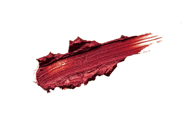 Smudged smeared lipstick stroke on white isolated background - Photo, Image