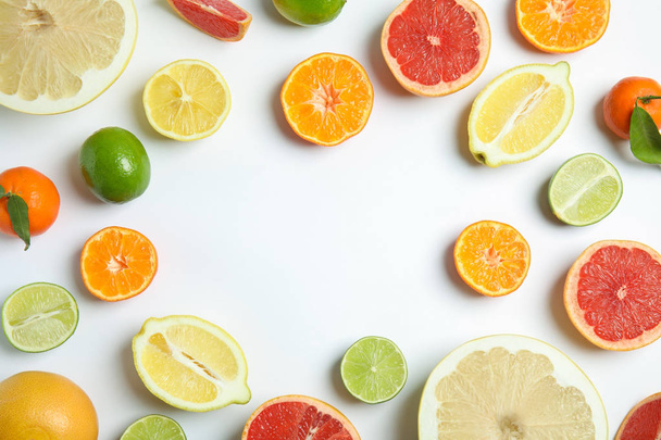 Different citrus fruits on white background, flat lay. Space for text - Φωτογραφία, εικόνα