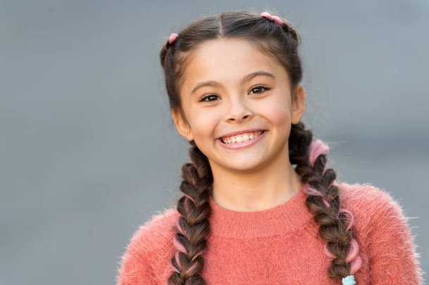Happy little girl. Beauty and fashion. small girl child with perfect hair. International childrens day. small kid fashion. Childhood happiness. The future of fashion. healthy teeth - Φωτογραφία, εικόνα