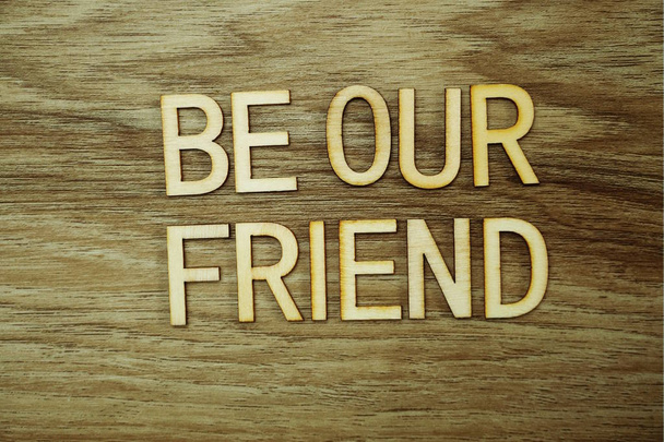 Be our Friend text message on wooden background - Fotó, kép
