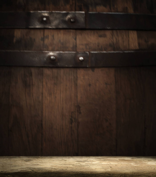 background of barrel and worn old table of wood - 写真・画像