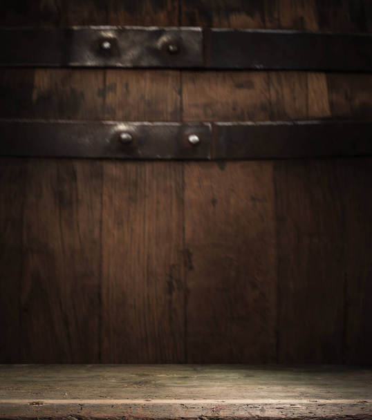 background of barrel and worn old table of wood - Photo, Image