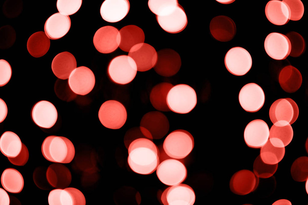 Coral Color abstract background with bokeh and defocused lights. Festive concept.  - Photo, image
