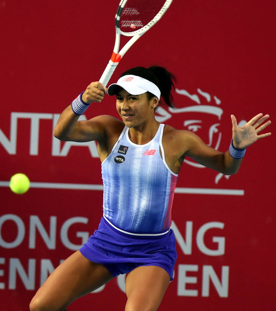 Heather Watson of Great Britain returns a shot to Caroline Wozniacki of Denmark in their women's singles second round match during the WTA Hong Kong Open 2016 tennis tournament in Hong Kong, China, 13 October 2016 - Фото, зображення