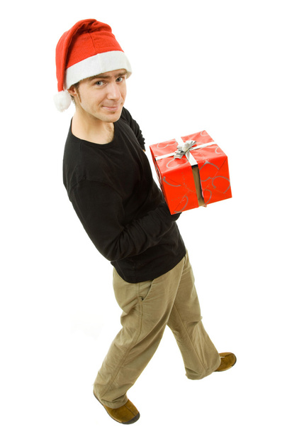 Jeune homme avec chapeau de Père Noël tenant un cadeau
 - Photo, image