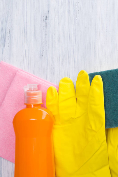 cleaning kit, sponge, rag, bottle with cleaning agent and rubber glove, on a light background, with space for writing - Foto, immagini