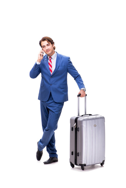 Joven hombre de negocios guapo con maleta aislada en blanco
  - Foto, Imagen