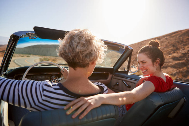 Mum and adult daughter in open top car, back view, close up - Foto, Imagem