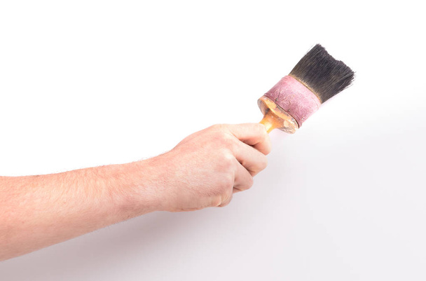 Man using old paint brush, on white background - Photo, Image