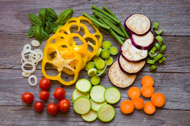 Fresh cut vegetables on wooden table - Photo, Image