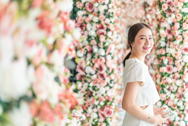 beautiful Asian woman with flower arches - valentine concept - Photo, Image