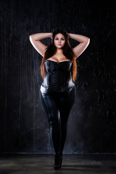 Plus size fashion model in sexy clothes, fat woman on black background, overweight female body, full length portrait - Фото, зображення