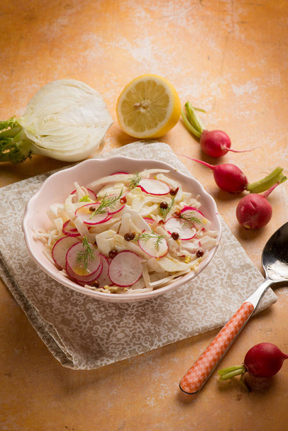 mixed salad with fennel, radishes,  lemon and pink pepper - Φωτογραφία, εικόνα