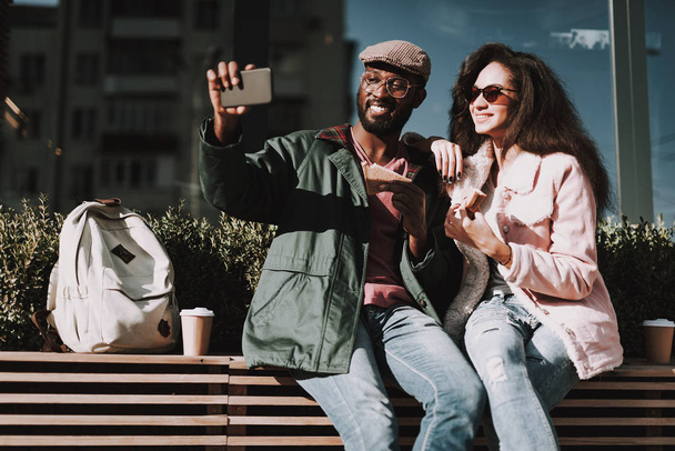 Waist up of young couple making selfie by phone - Photo, Image
