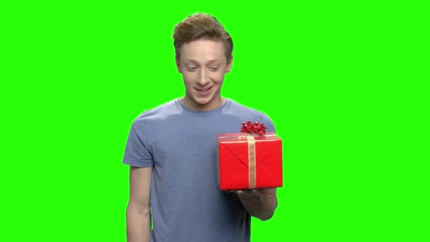 Caucasian boy giving box gift. - Footage, Video