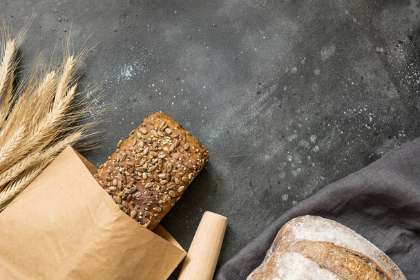 Homemade rye bread on dark. Close up. Copy space. - Фото, зображення