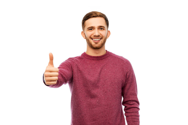 happy young man showing thumbs up - Фото, зображення